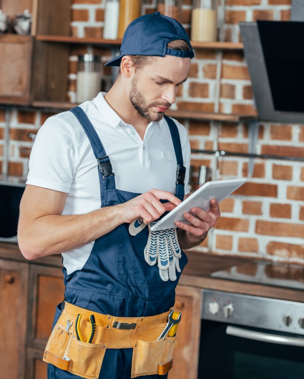 handsome young professional home master using digital tablet handsome young professional home master using digital tablet